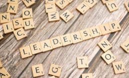 the word leadership spelled out in scrabble letters