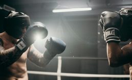 man in black boxing gloves