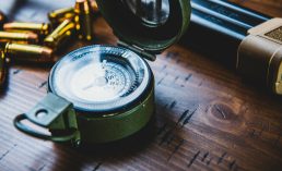 vintage compass on wooden surface