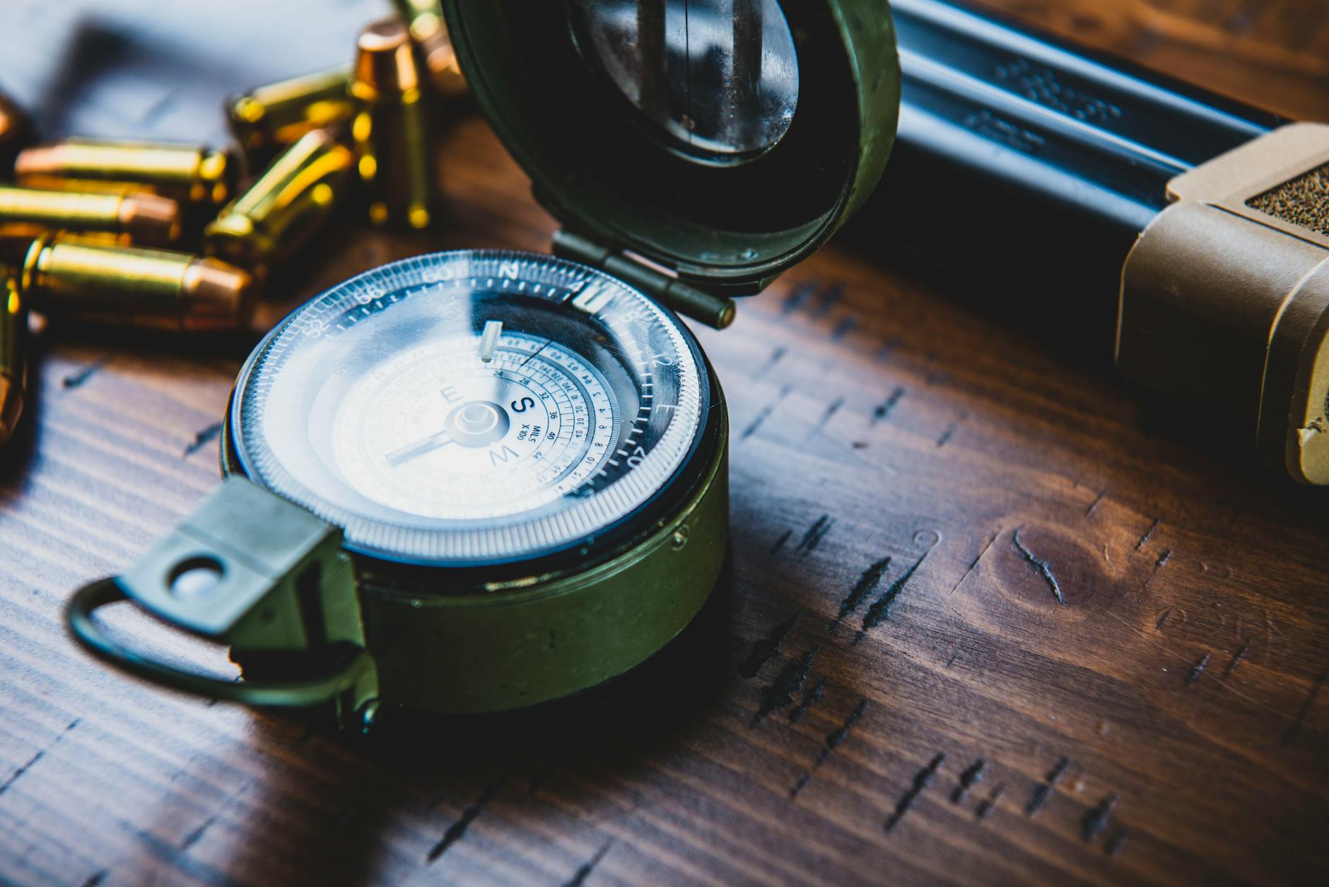 vintage compass on wooden surface